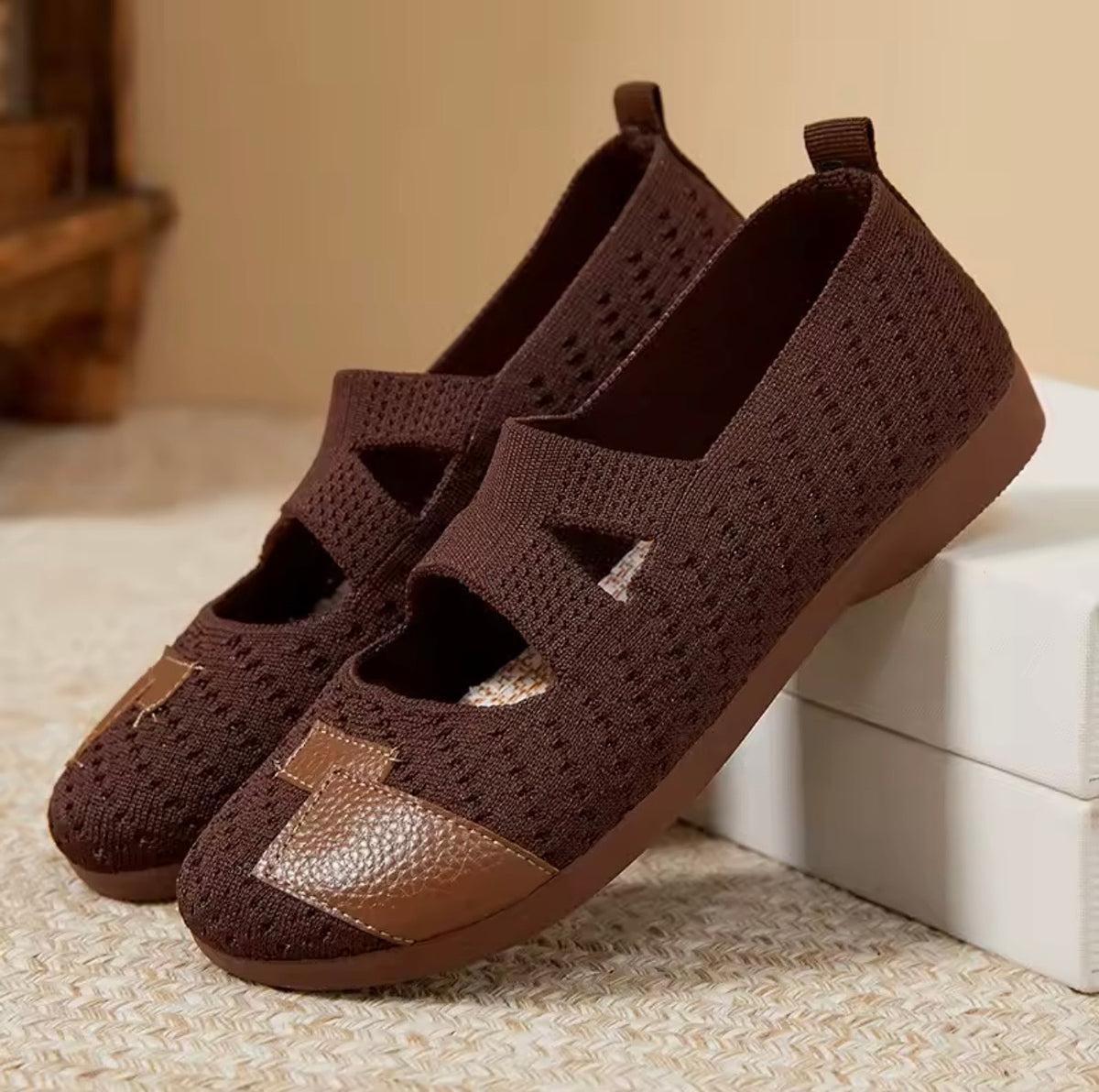 Slip-on shoes in dark brown knit with medium brown soles and pebbled toe overlay.